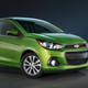 A photo of a green Chevrolet Spark hatchback.